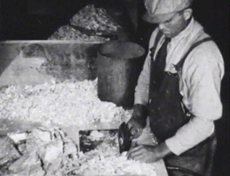 Asbestos cobber handling raw asbestos