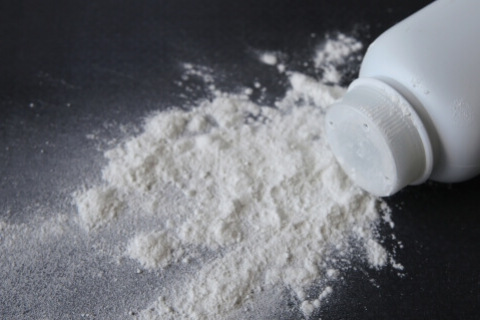 White talcum powder on black background