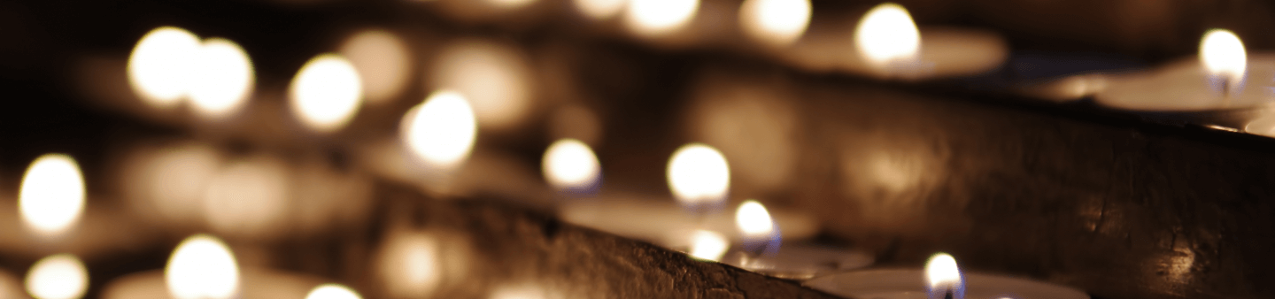 lit candles in loving memory background